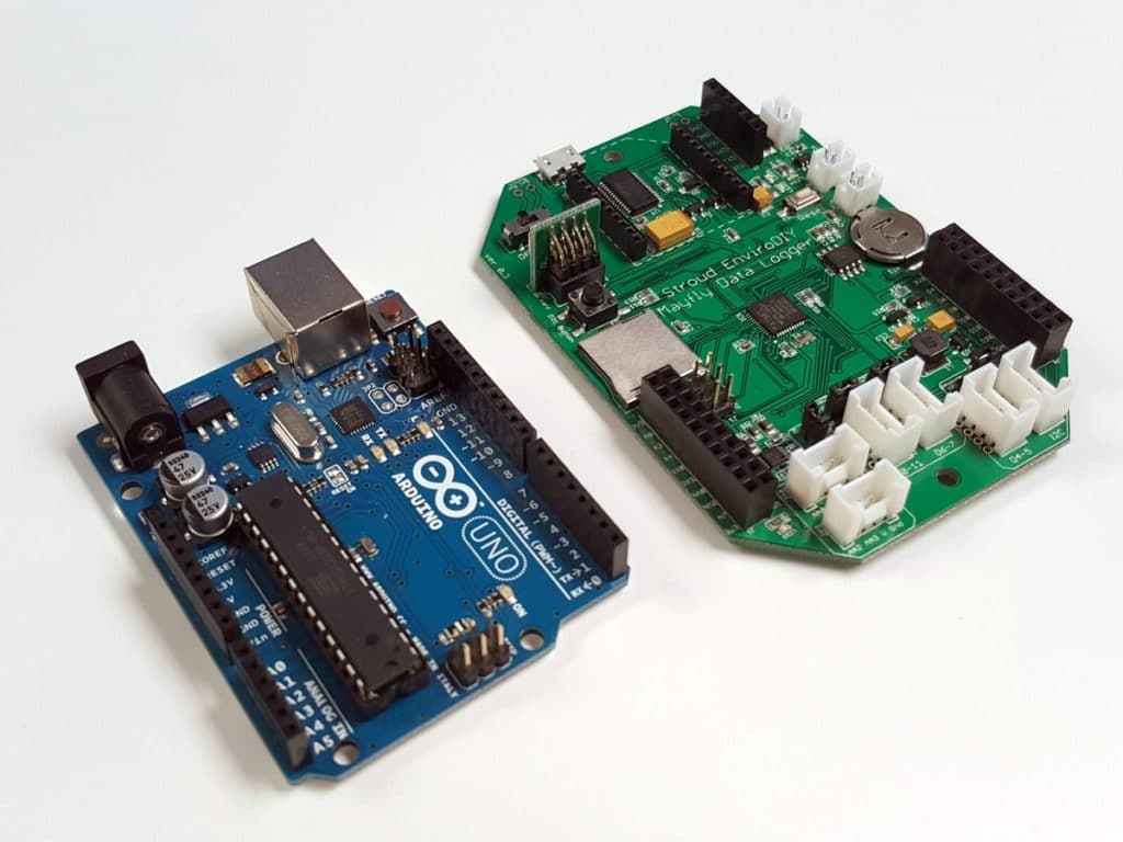 The Arduino Uno and EnviroDIY Mayfly Data Logger side by side for size comparison.