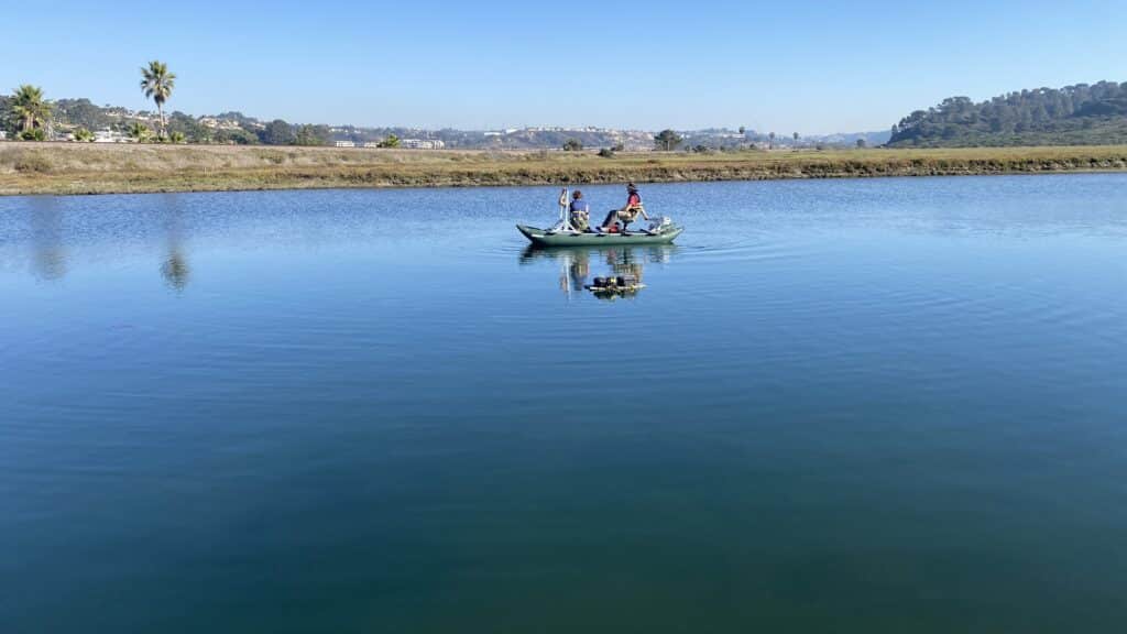 A team deploys groups of instrumented oysters and mussels on floating moorings in Los Penasquitos Lagoon.