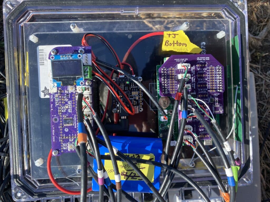 A biosensor setup containing a Mayfly Data Logger, Teensy 3.5 data logger, and Adafruit solar panel battery charge controller and battery pack.