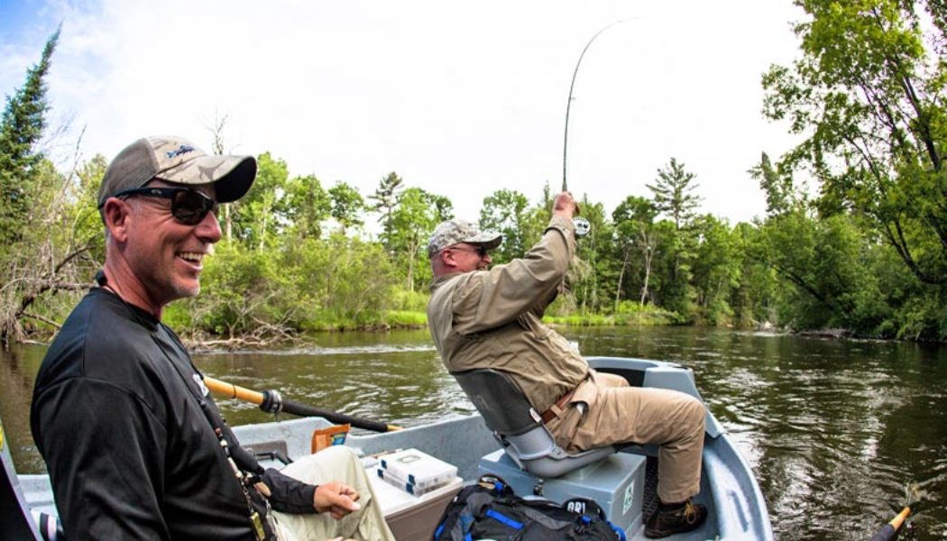 Photo of Guide Ed McCoy and a client on the Manistee River, Michigan.