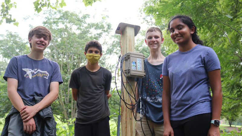 Students proudly reveal their EnviroDIY Monitoring Stations.